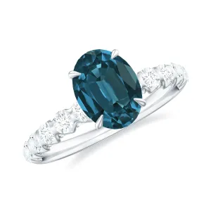 Royal London Blue Topaz Solitaire and Diamond Side Stone Engagement Ring